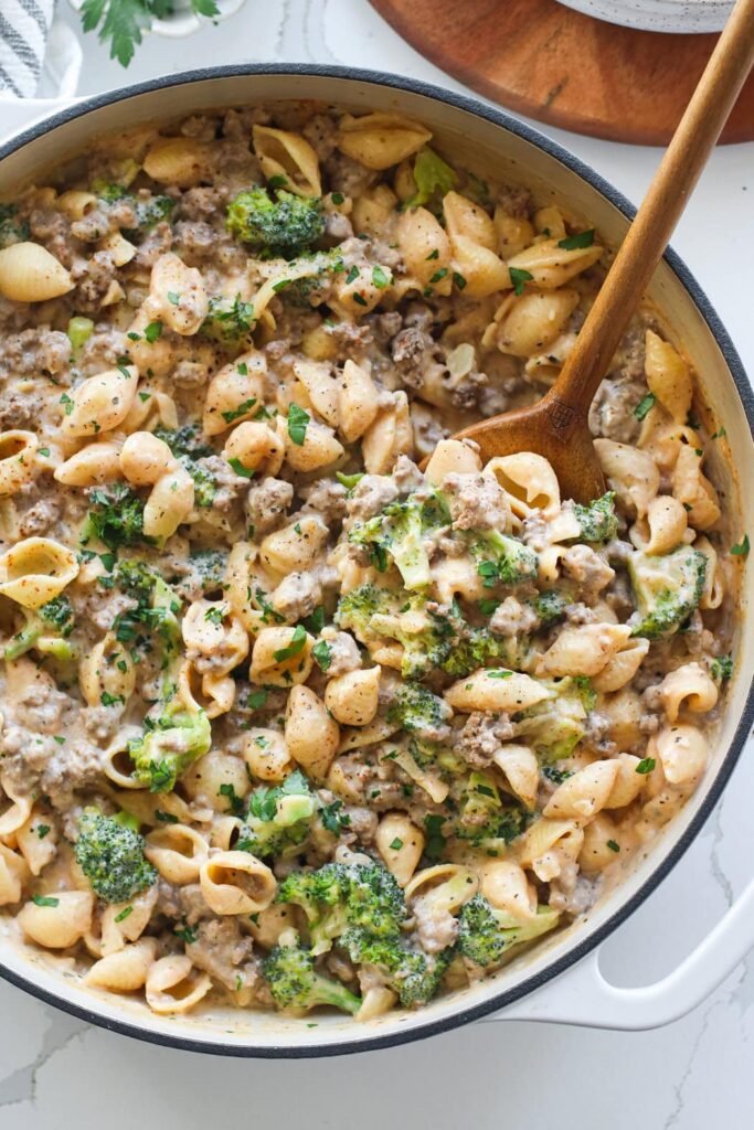 Overhead view of a skillet of fresh Homemade Hamburger Helper topped with fresh herbs.